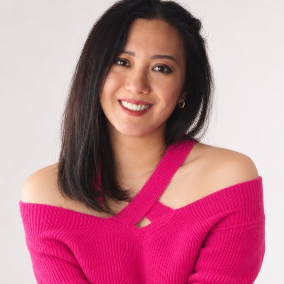 Liya Bergen smiling in a pink jumper